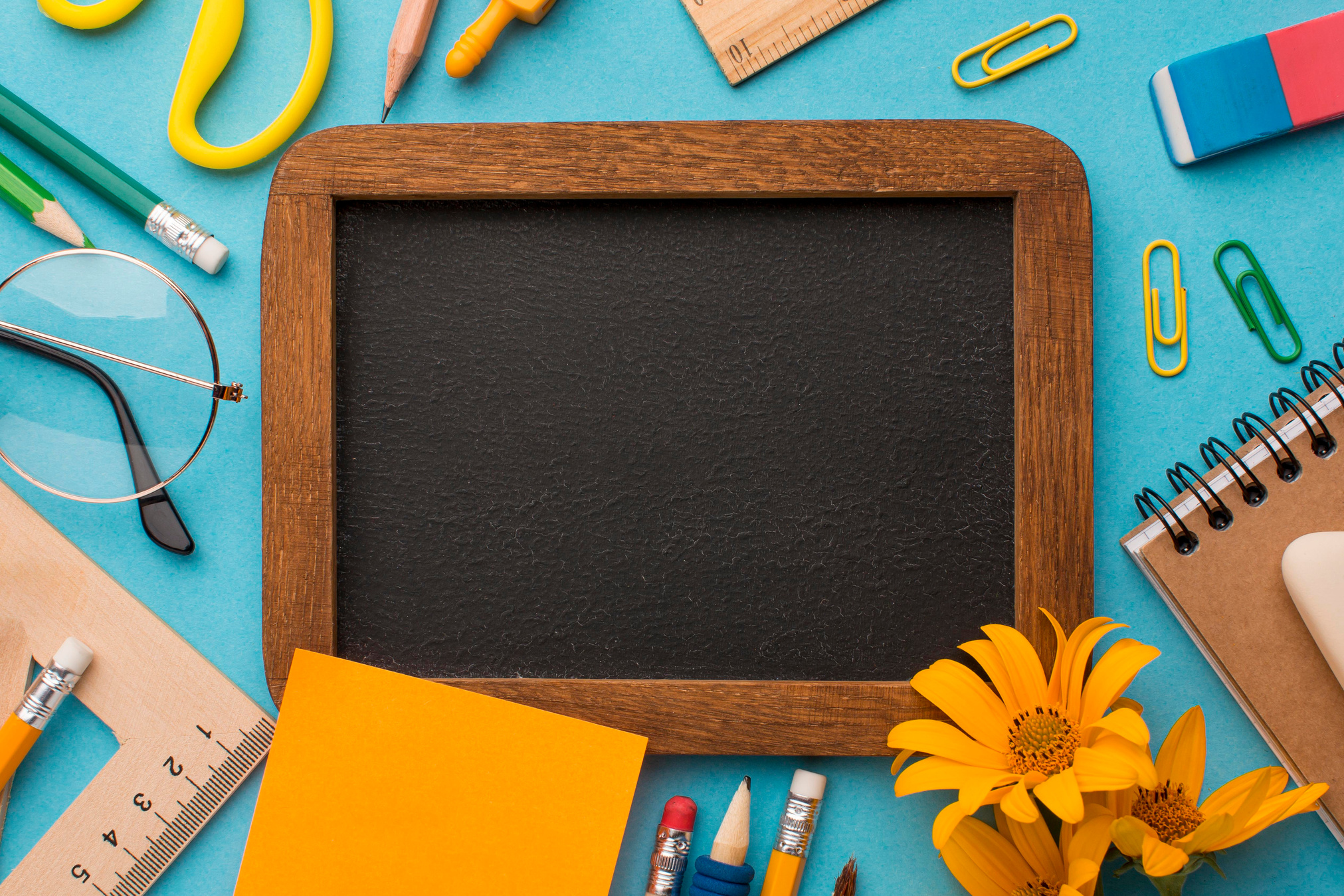 Blank Chalkboard with School Supplies